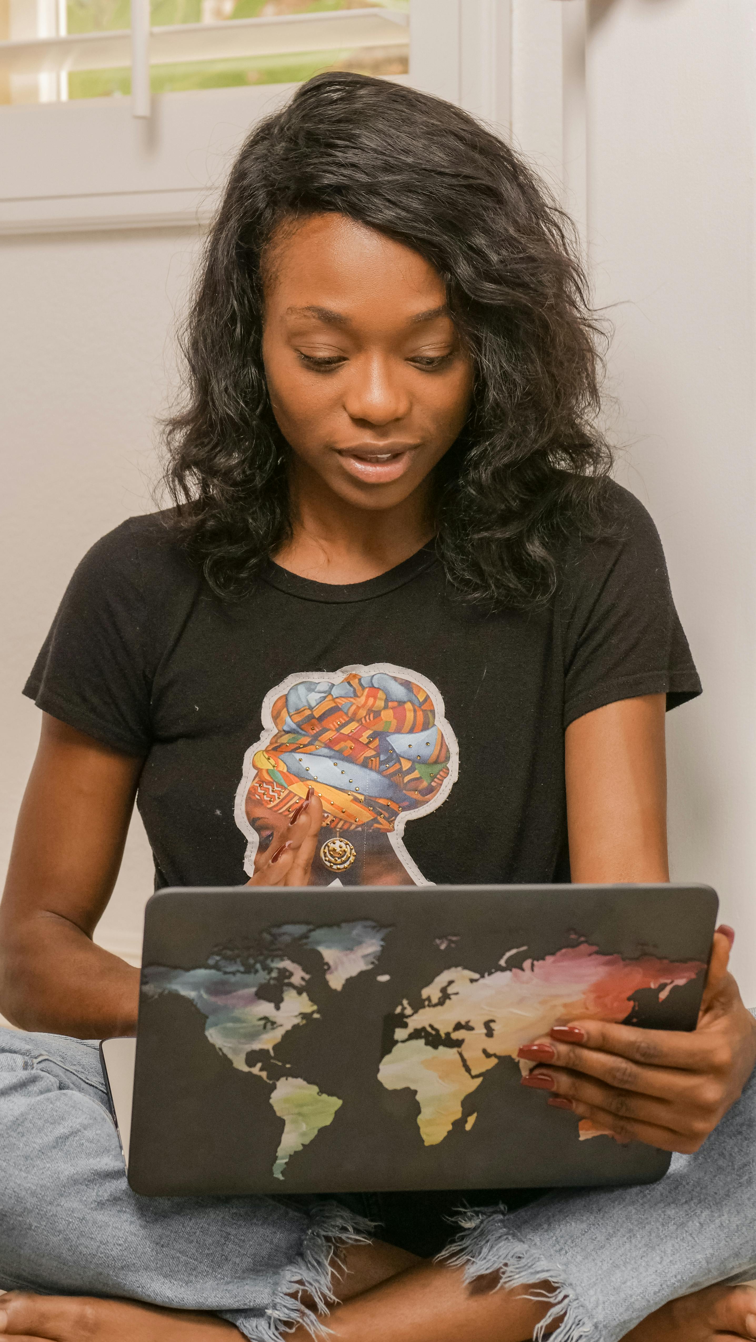 woman in black shirt using laptop
