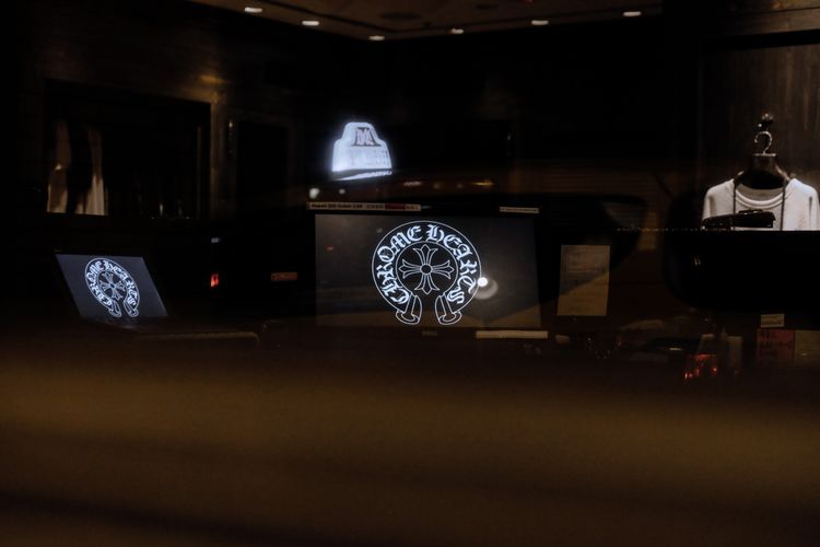 Transparent DV-LED display in a retail window at night showing dynamic content