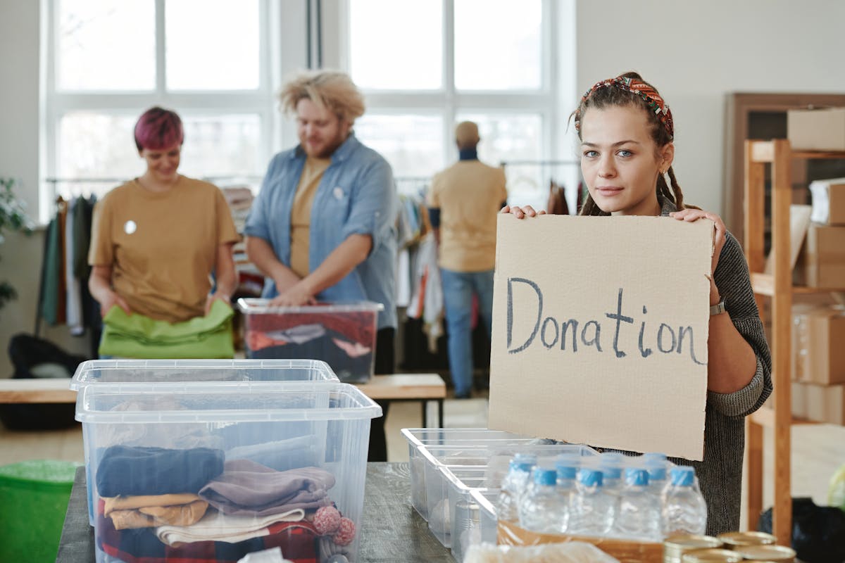 Volunteers preparing food and care packages at a homeless shelter