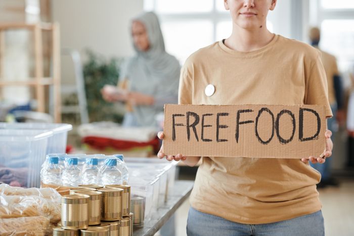 Volunteers packing boxes of groceries for a food pantry, photo by Julia M Cameron on Pexels