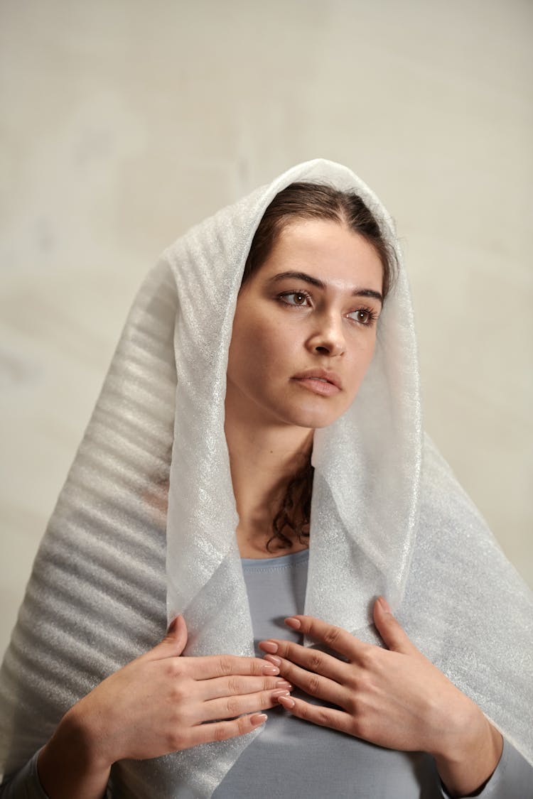 A Woman Wearing A Plastic Veil