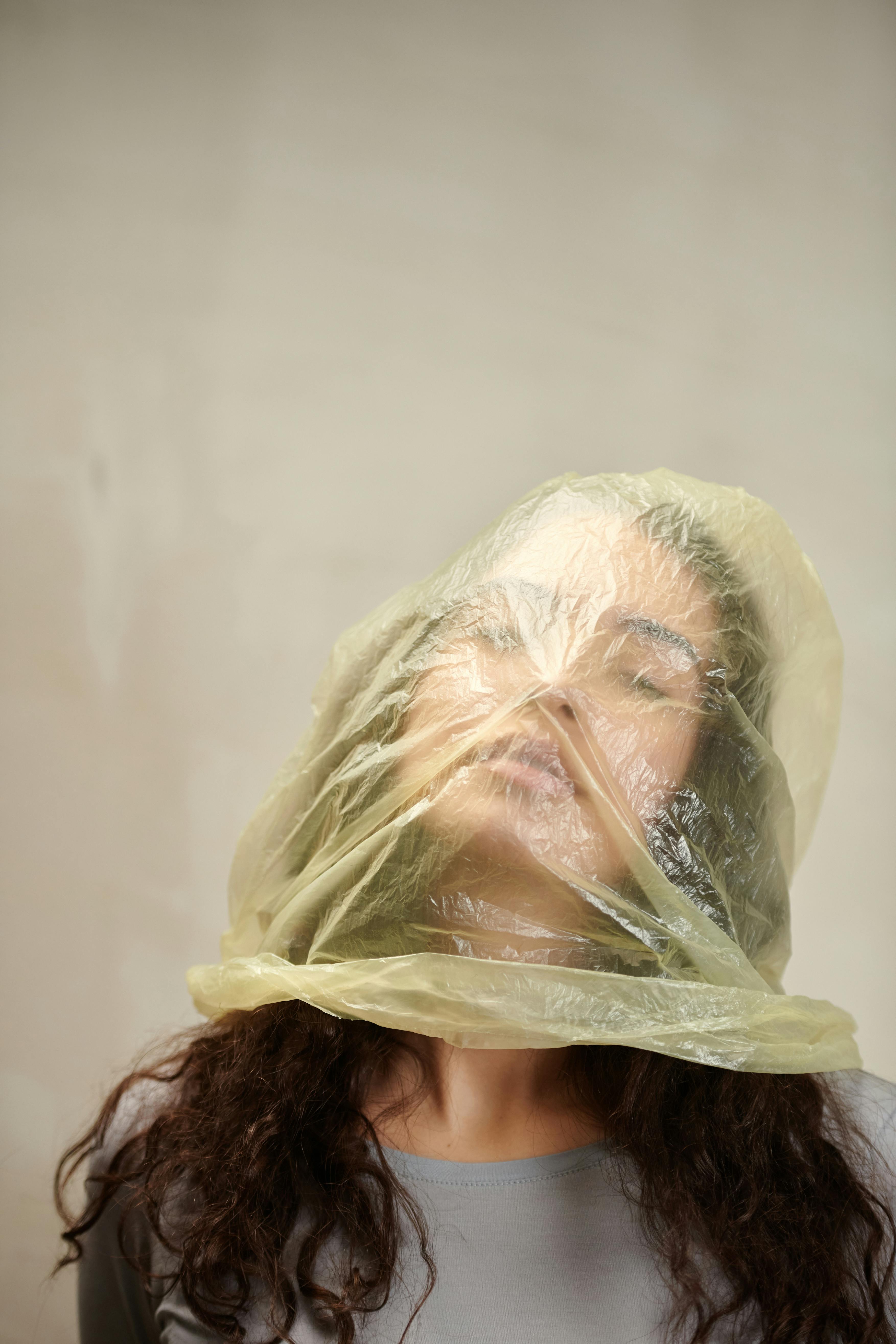 A Woman Wearing Bag on Her HEad · Free Stock Photo