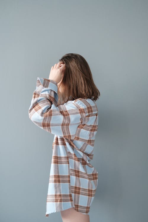 Side View of a Woman in a Plaid Shirt