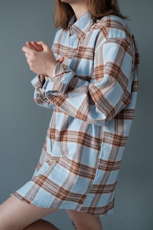 Person in Red White and Blue Plaid Dress Shirt