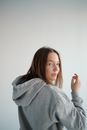 Young woman in gray hoodie