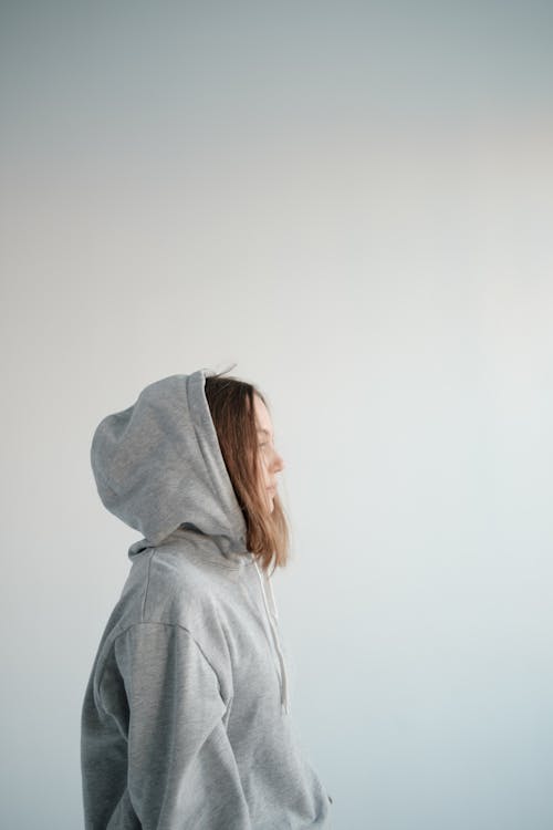 Stylish woman wearing hoodie in studio · Free Stock Photo