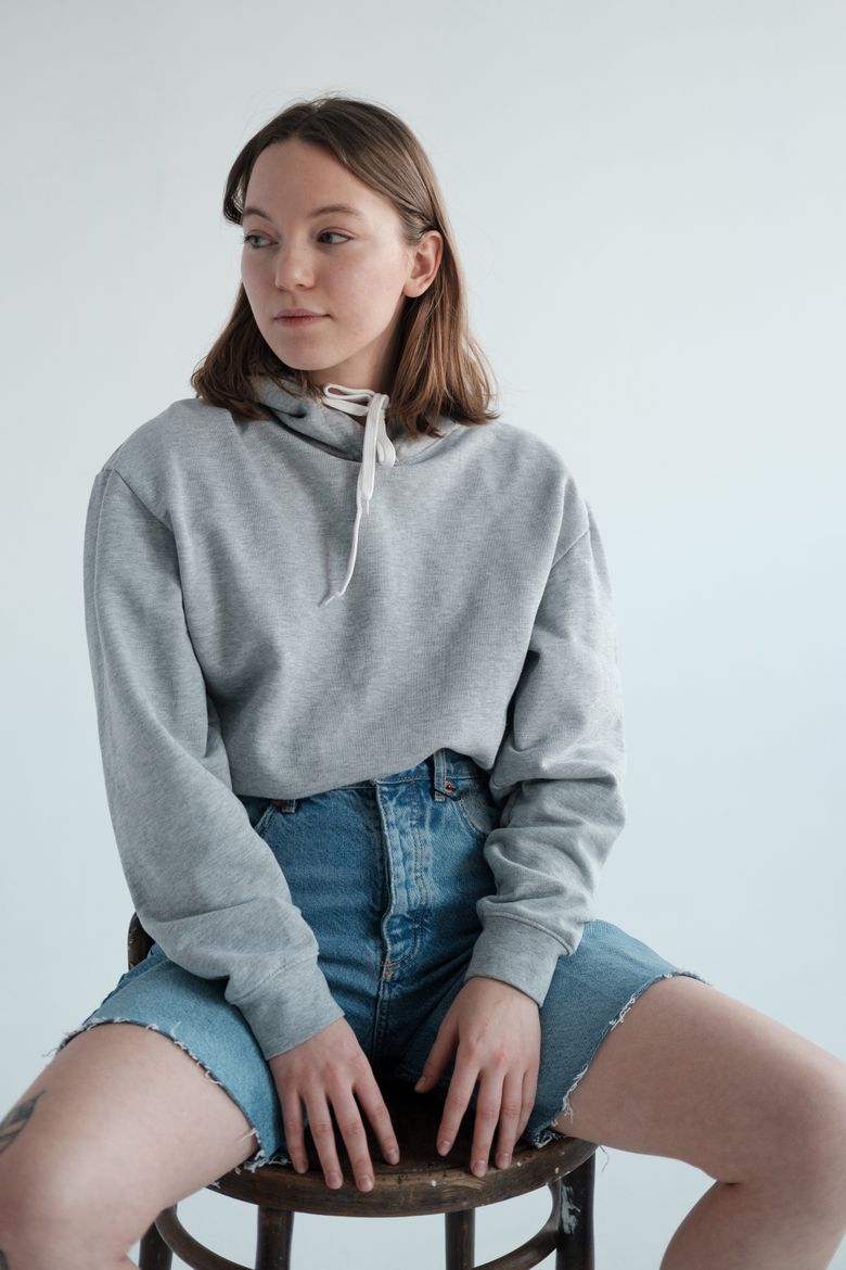 Vellum Hooded Top in grey marl &mdash; photo by Alena Shekhovtcova on Pexels