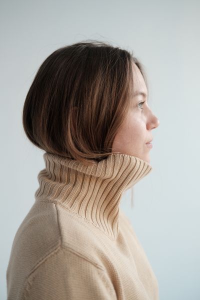 Woman in turtleneck with skirt