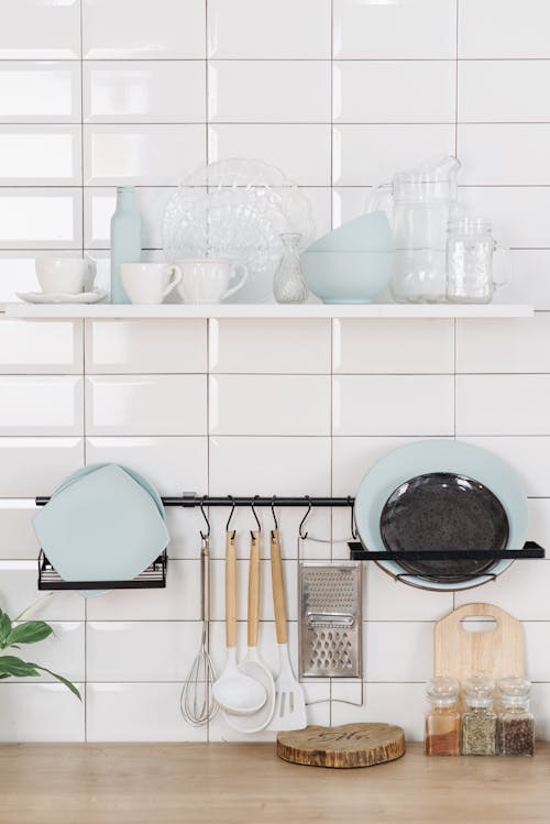 Kitchenware on White Wall and Wooden Table