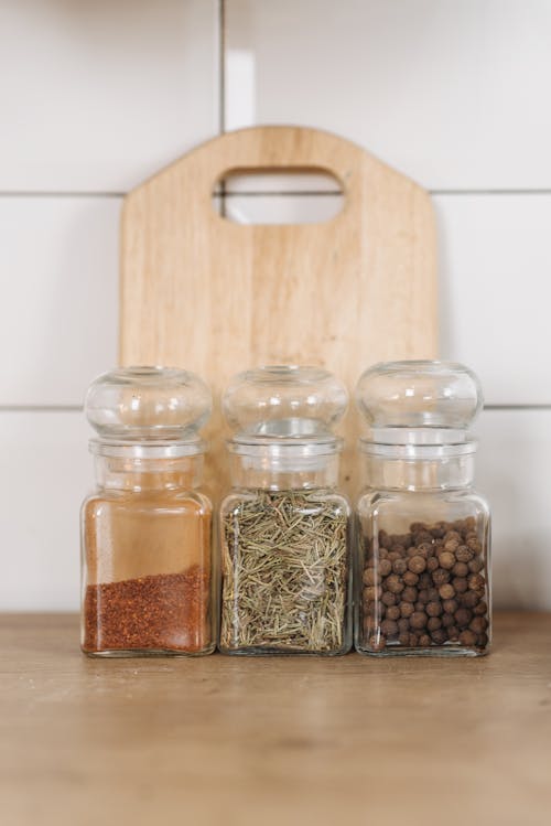 Free Clear Glass Jars with Herbs and Spices Stock Photo