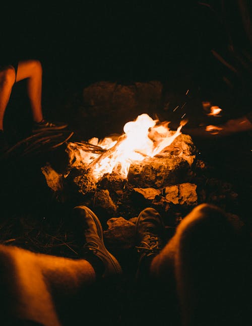 Free Group of People Sitting Beside the Bonfire during Night Time Stock Photo