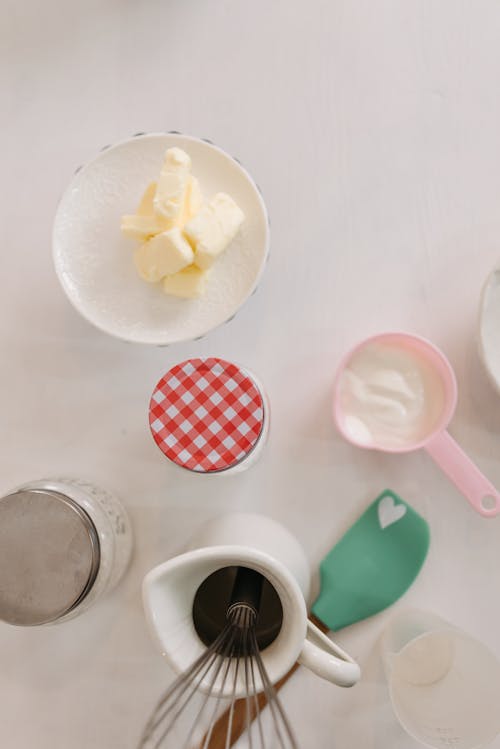 White Ceramic Mug With Yellow Liquid and Yellow Flower