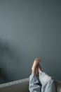 Barefoot female lying on sofa at home