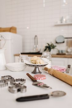 Warm kitchen scene featuring baking tools and dough, perfect for home cooking themes.