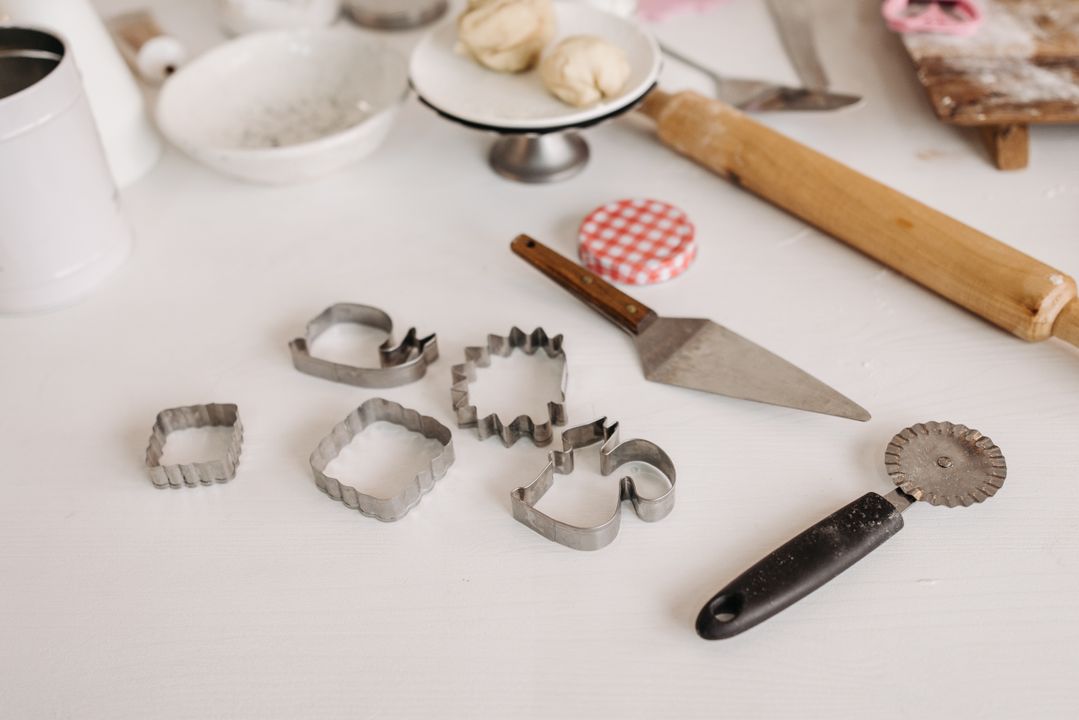 Cloud Kitchen vs Home Bakery: Which Food Business Model Is Right for You in India? 1 Flat lay of home baking equipment including stand mixer, baking tins, and packaged goods on a clean kitchen counter