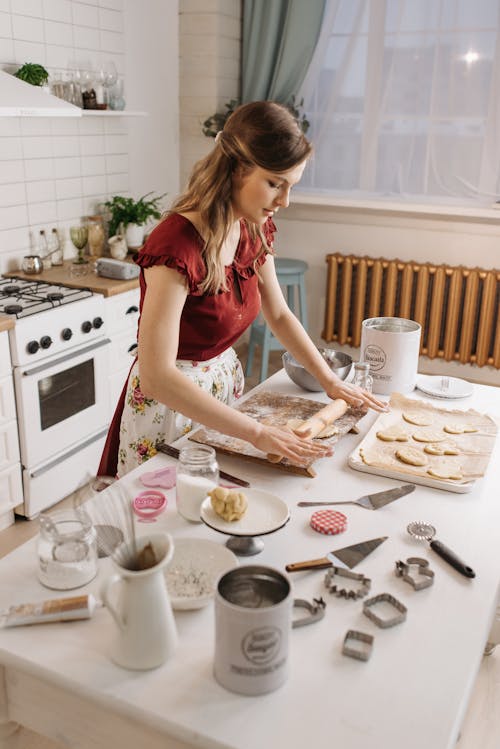 Woman in Red Sleeveless Shirt Kneading Dough