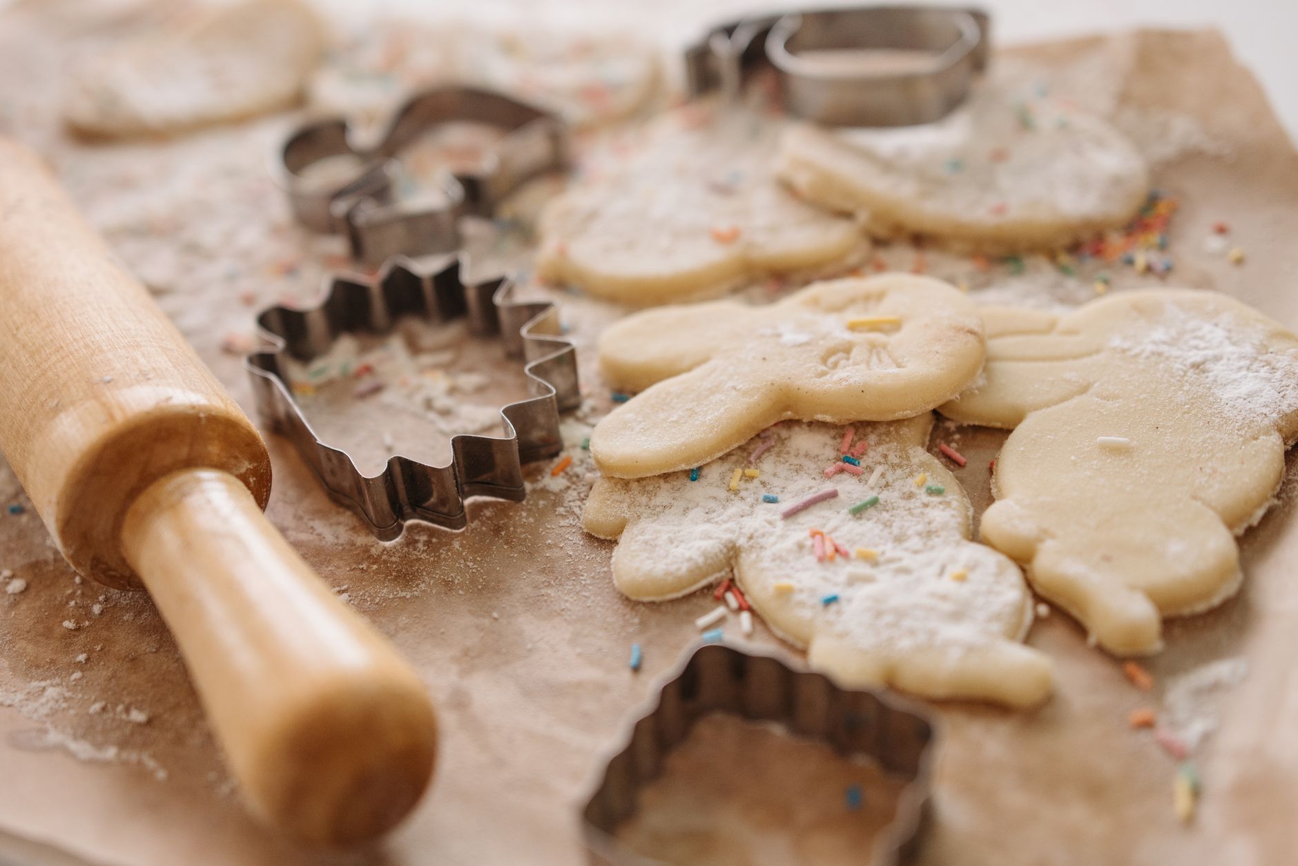 Variety of almond flour cookies arranged on baking tray, showcasing different flavors