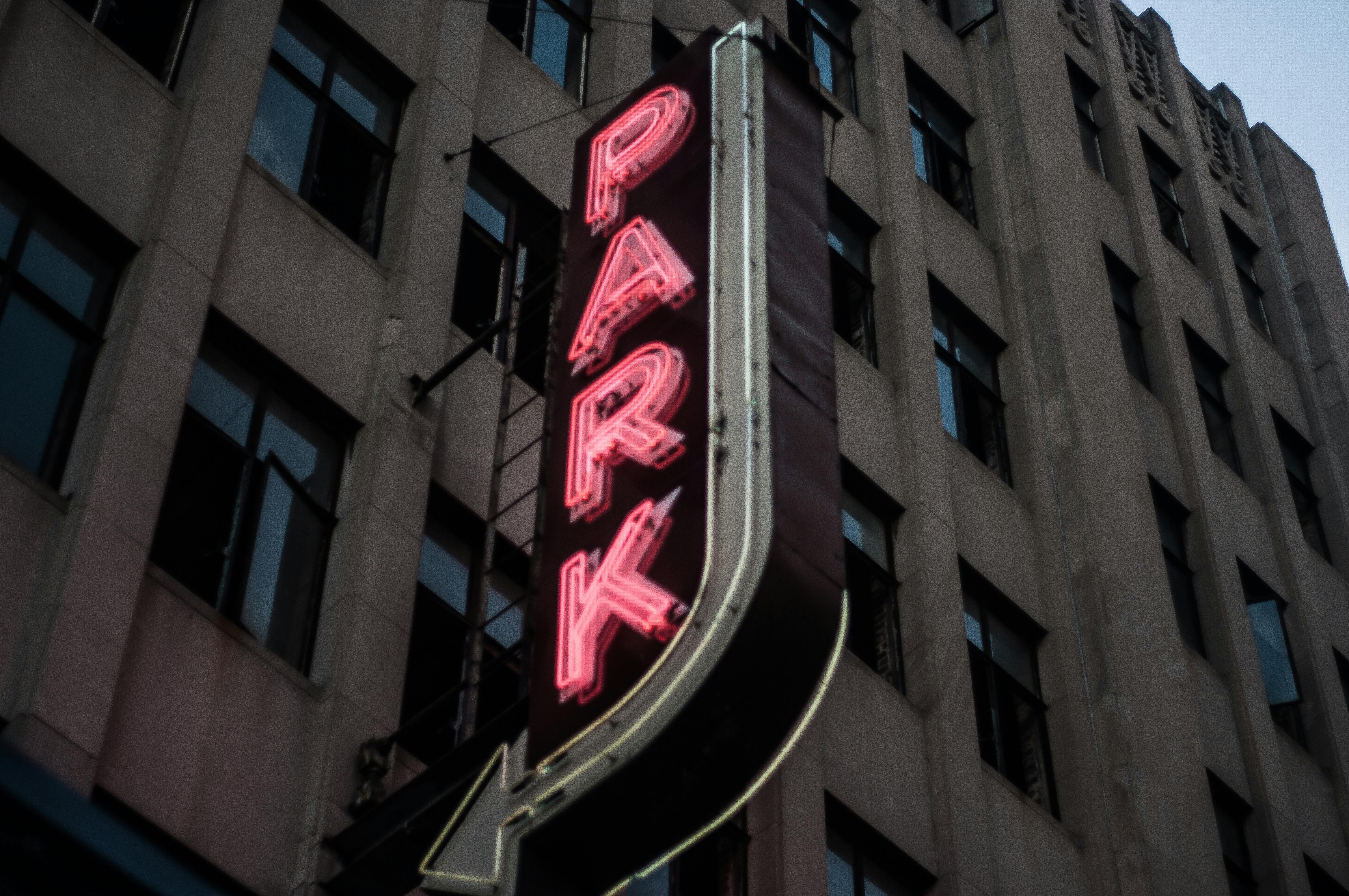 Free stock photo of multi storey car park, neon sign, parking