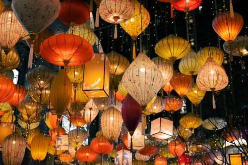 Free A stunning display of colorful lanterns illuminated at night, capturing the essence of a festival celebration. Stock Photo