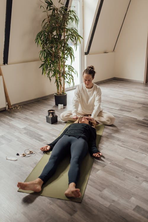 Therapist Holding a Woman on the Head