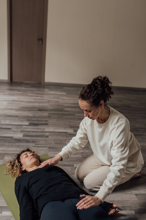 Therapist Doing a Treatment to a Patient