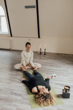 A serene indoor therapy session with women practicing yoga and mindfulness.