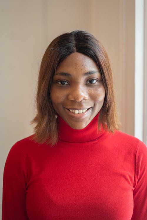 Positive black woman in room