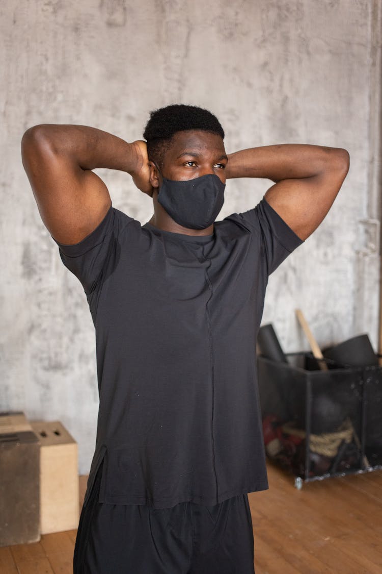 Black Sportsman In Cloth Face Mask In Room