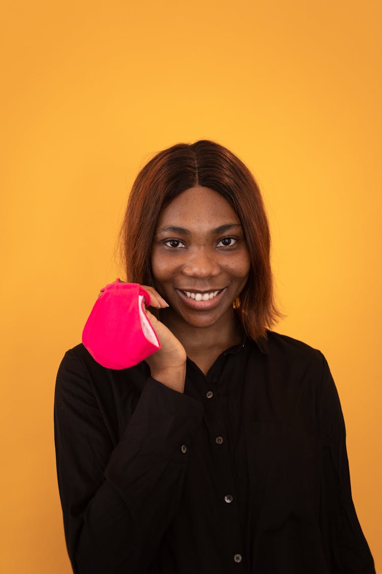 Cheerful Black Woman With Pink Mask Near Face