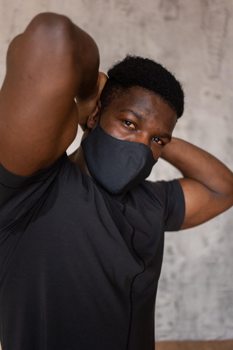 Muscular Black Man In Protective Mask