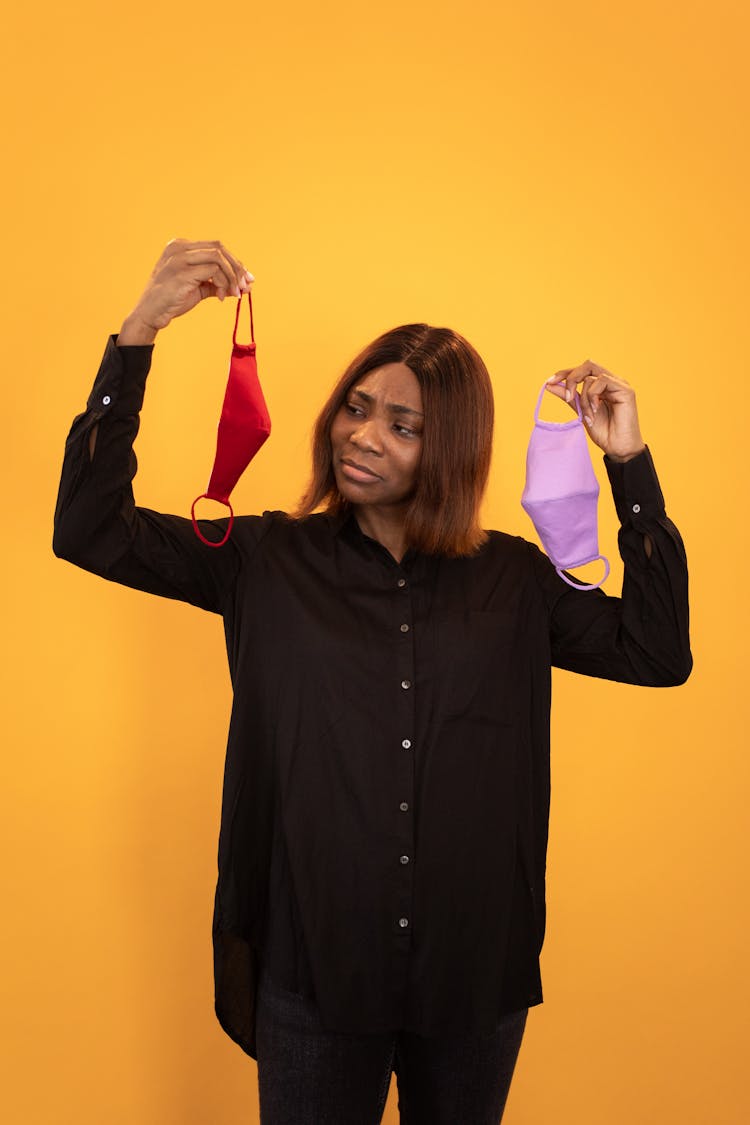 Confused Black Woman Choosing Protective Masks