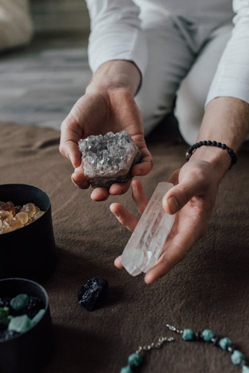 Person Holding Crystals and Natural Stones