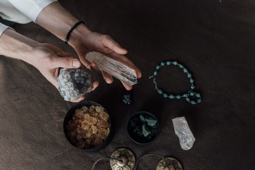 Hands holding crystals