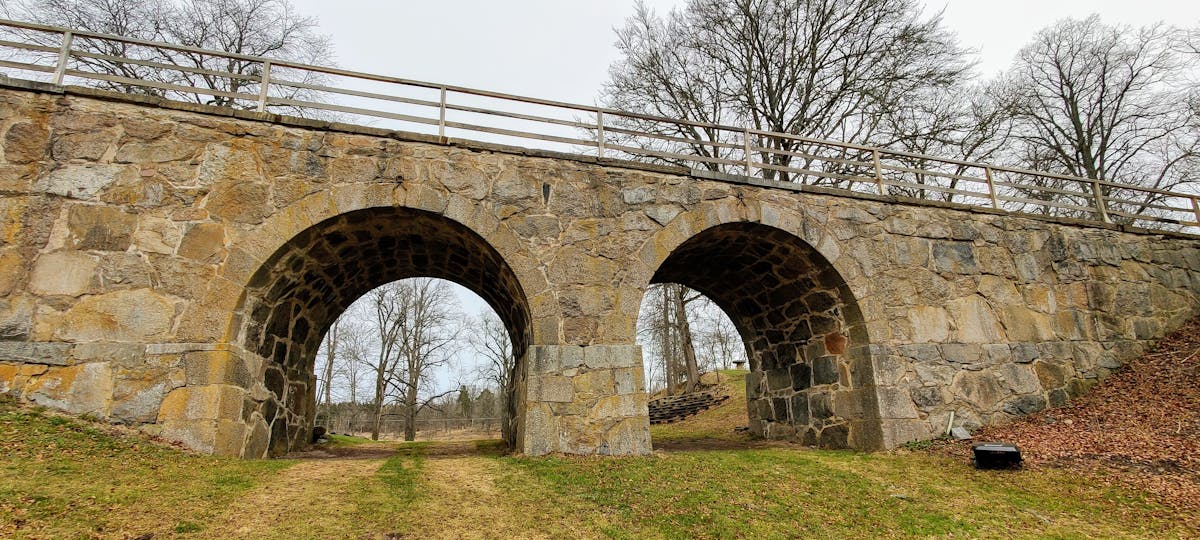 Person meditating in a living room with headphones on