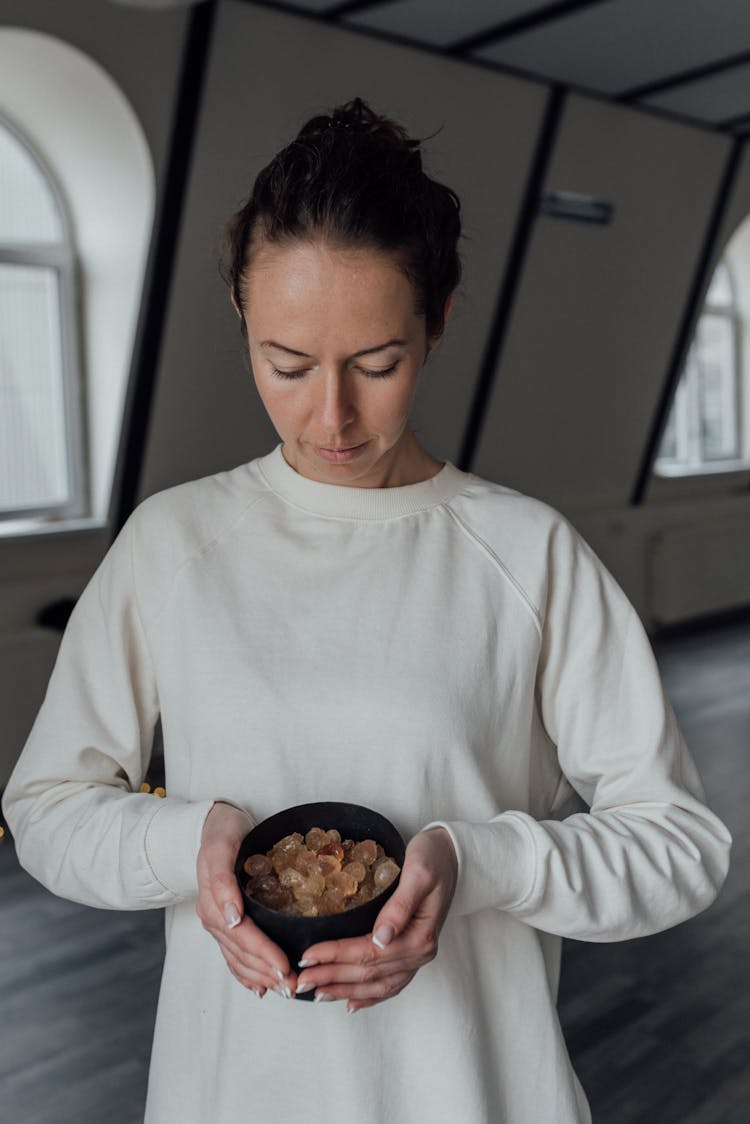 Woman Holding A Healing Bowl