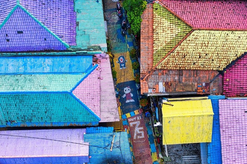 A vibrant aerial shot of colorful rooftops in Banten, Indonesia, showcasing artistic design and lively atmosphere.