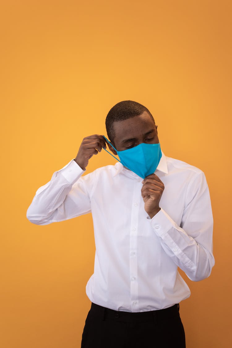 Calm Black Man Wearing Mask In Studio