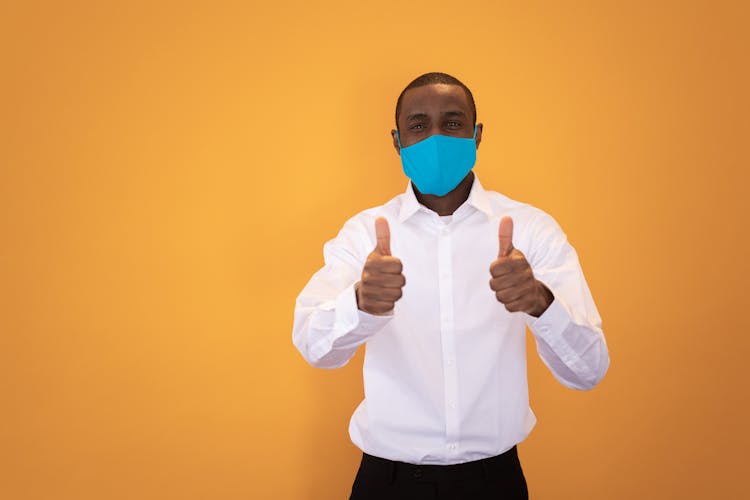 Black Man In Sterile Mask Showing Thumbs Up Sign