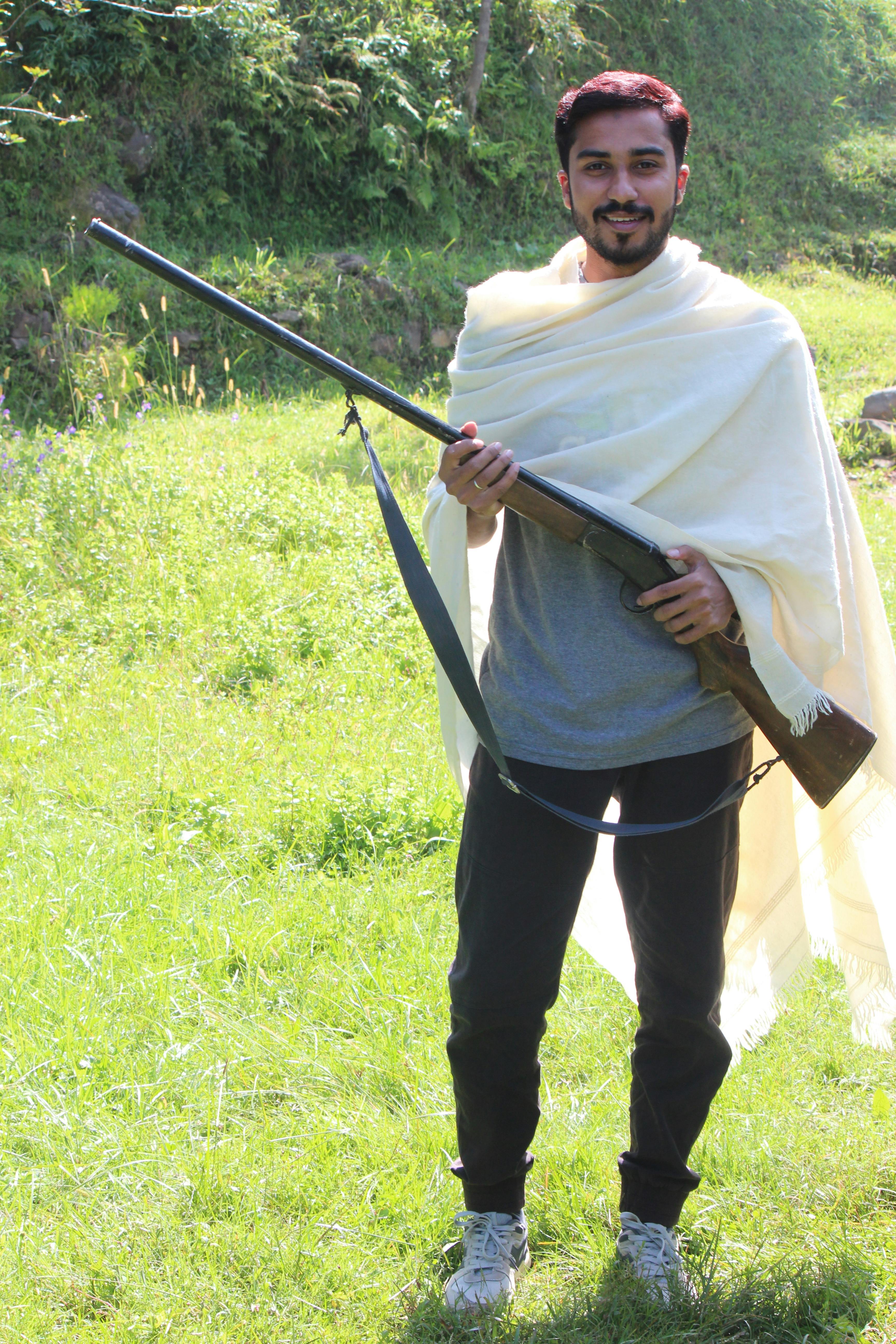 Person doing laundry and folding clean towels