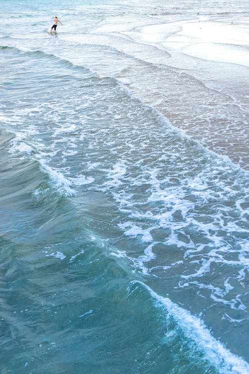 Aerial Shot of a Man Surfing 