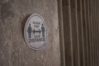 Please Keep Your Distance inscription on sign during coronavirus pandemic