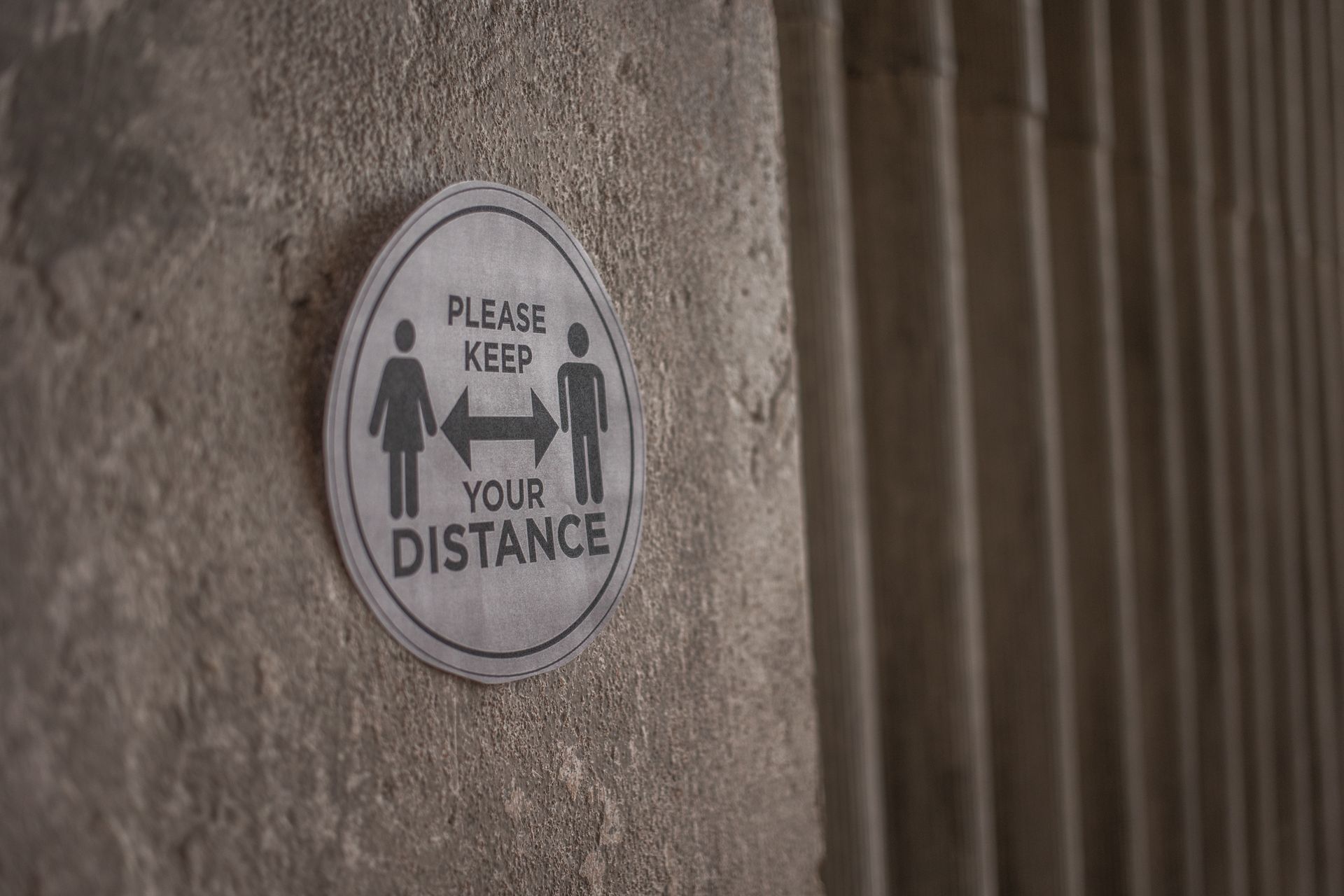 Please Keep Your Distance inscription on sign during coronavirus pandemic