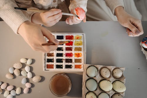 People Painting Eggs