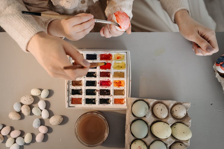 People Painting Eggs