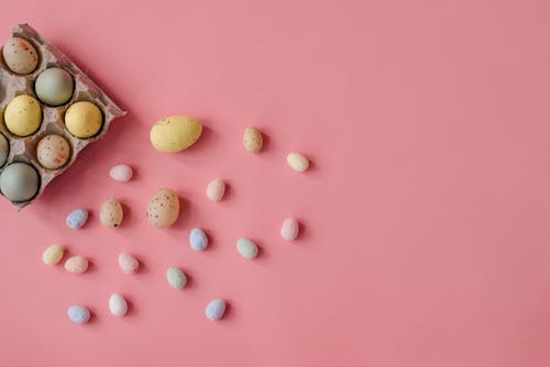 Flat Lay Photography of Easter Eggs on Pink Surface