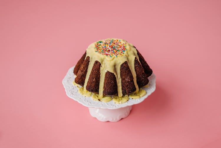 A Delicious Chocolate Cake Topped With Cream And Sprinkles