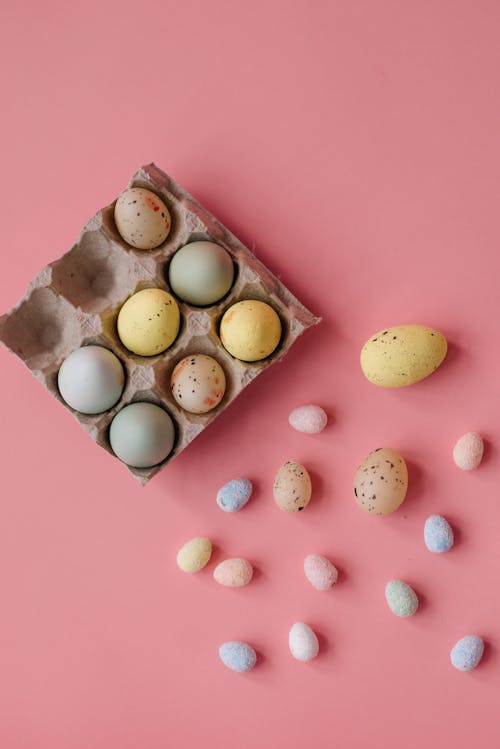 Flat Lay Photography of Easter Eggs on Pink Surface