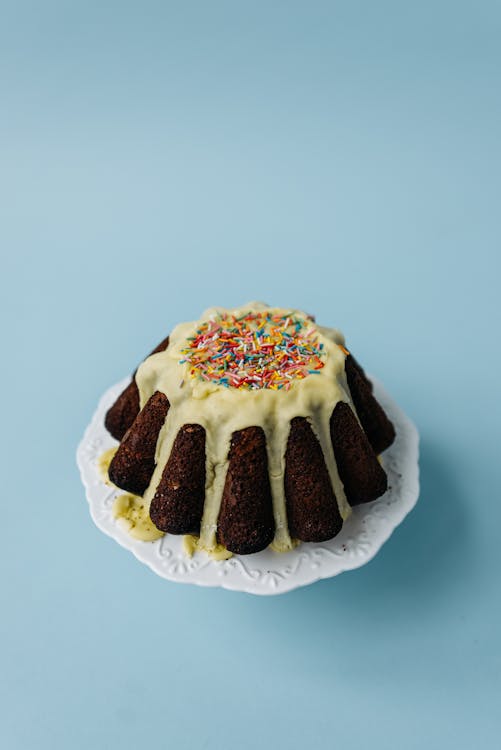 Free White and Brown Cake With Sprinkles on Top Stock Photo