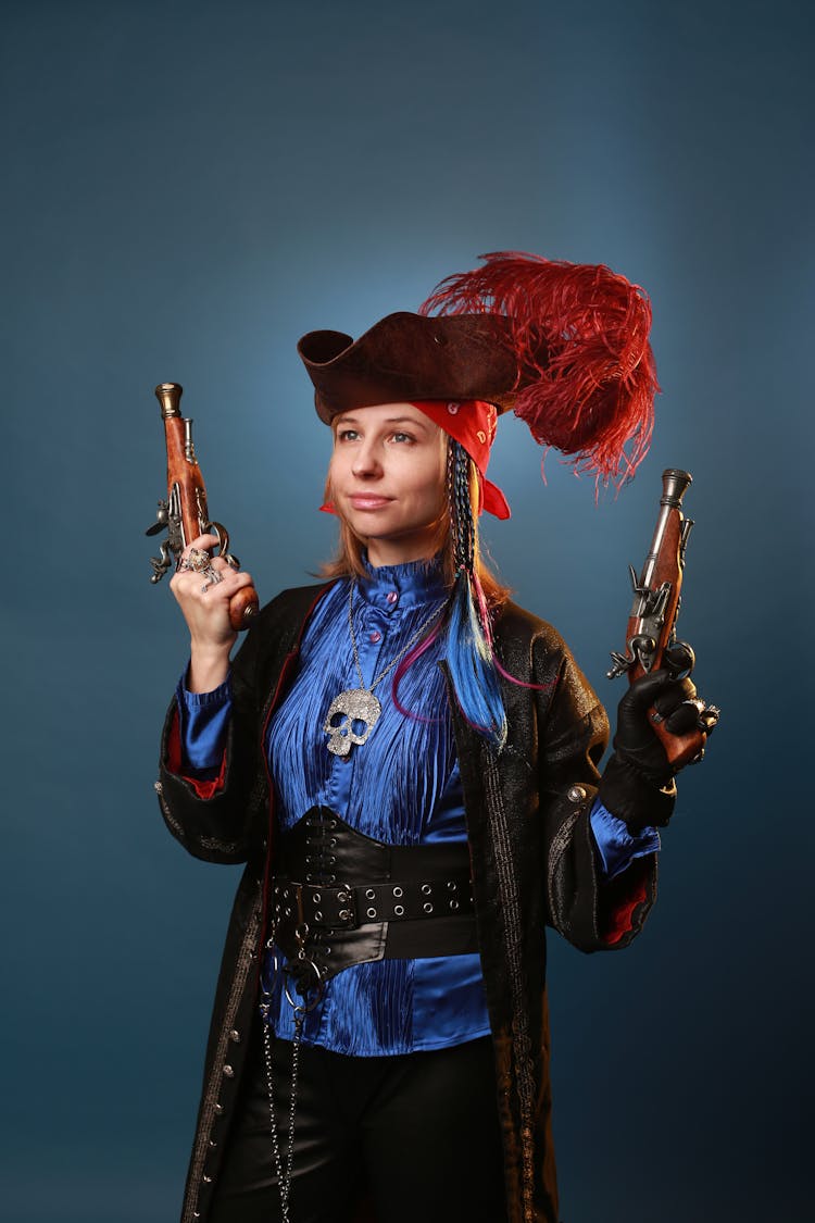 Smiling Model In Pirate Costume With Old Handguns