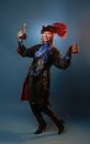 Drunk woman in pirate costume with rum and vintage mug